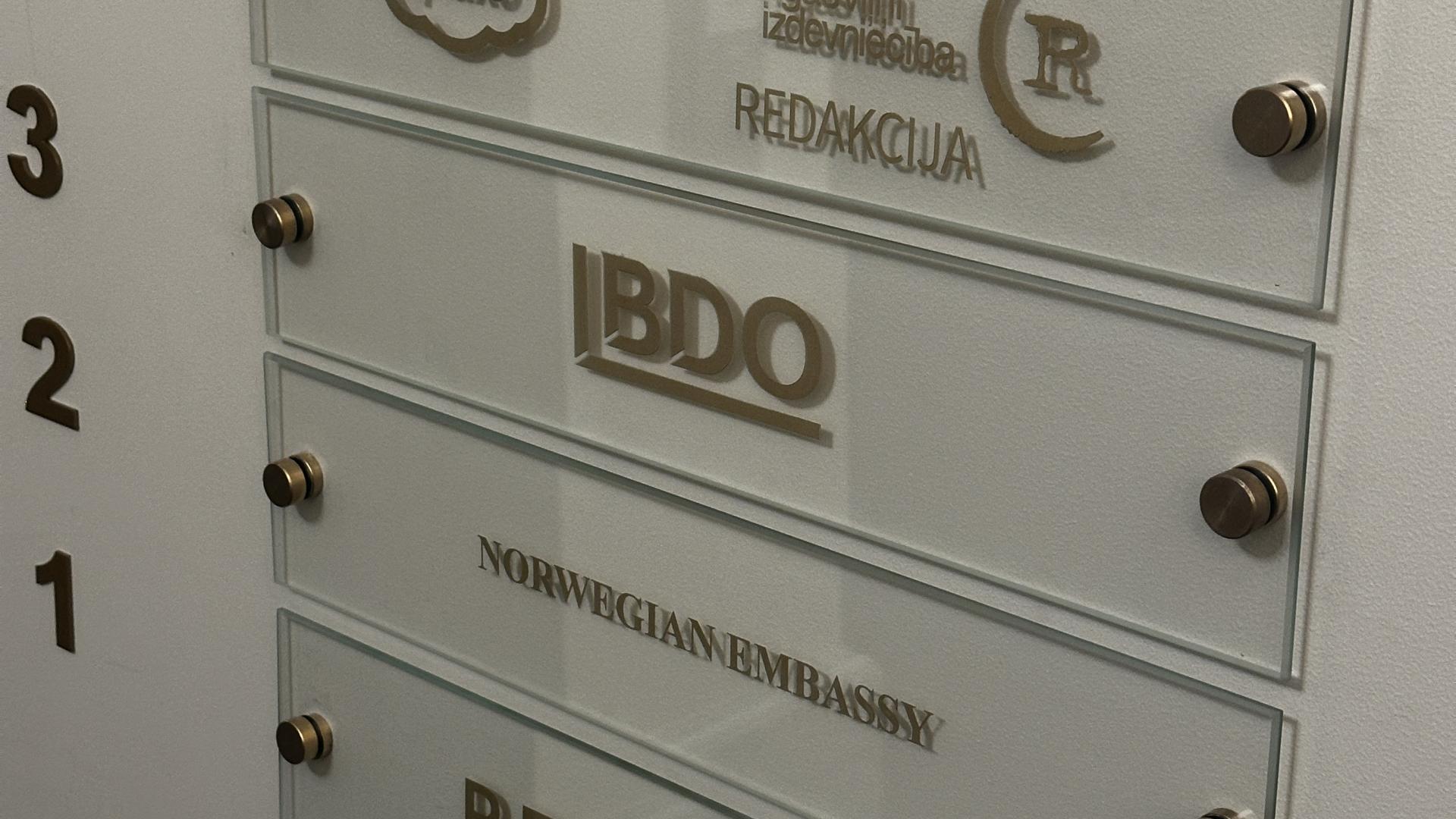Etched glass directory signage for an office building