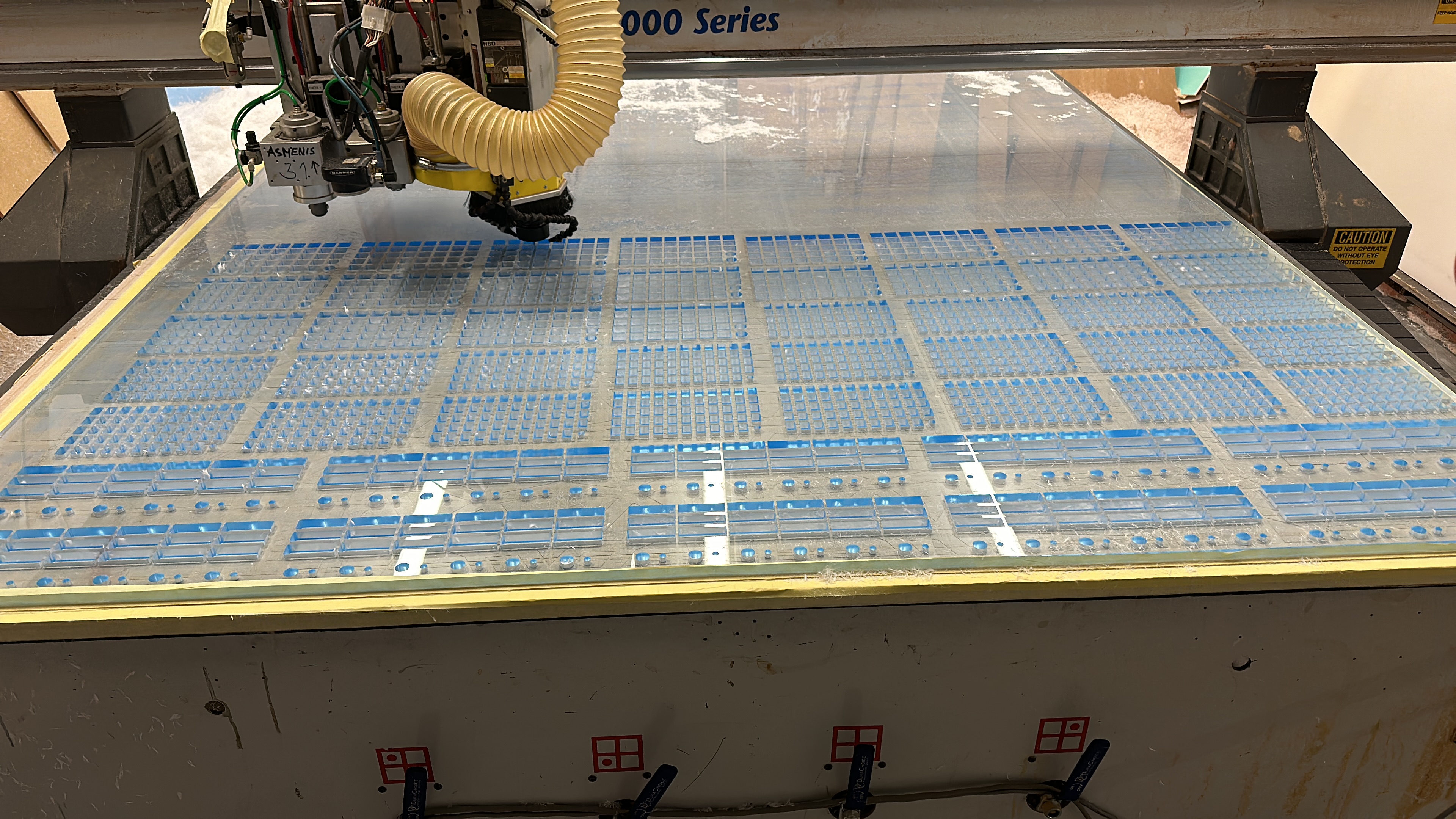 Laser-cut acrylic screens and CNC-milled fluted wood panels